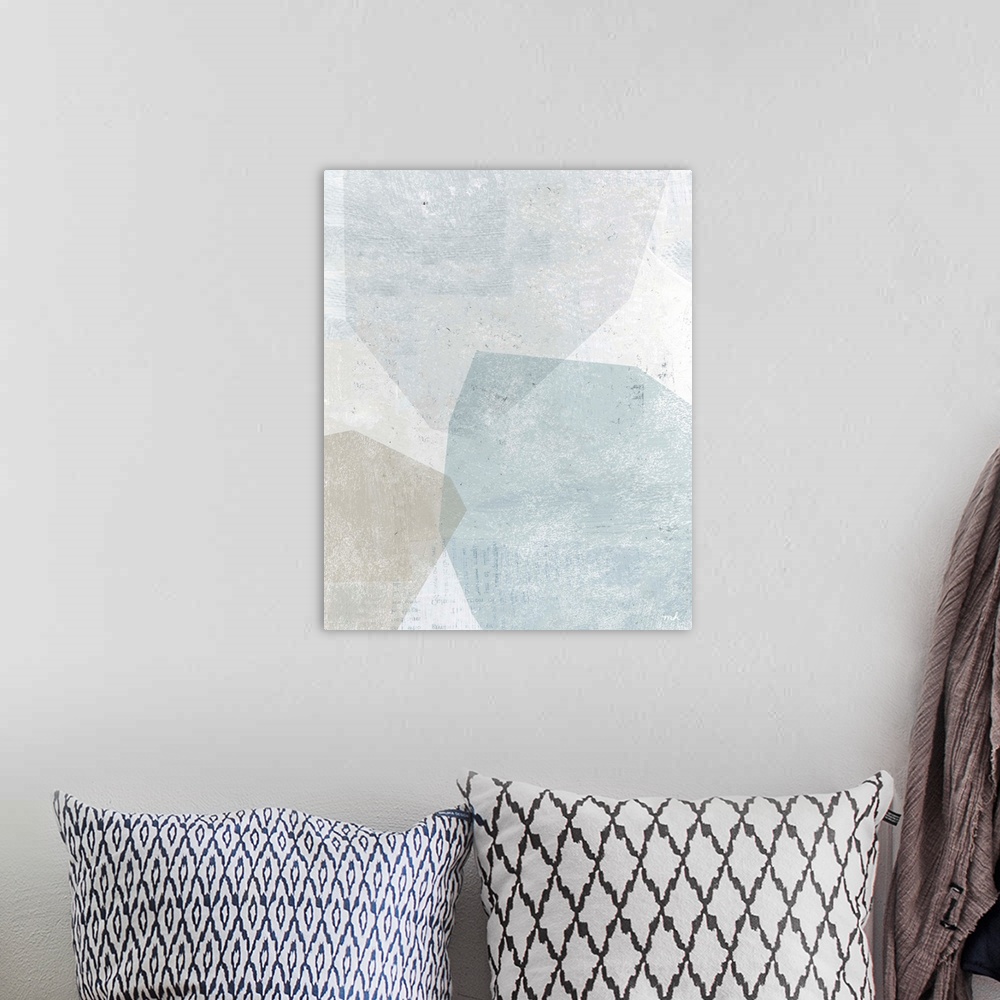 A bohemian room featuring Abstract painting with overlapping shapes in muted blue, white, and grey hues.