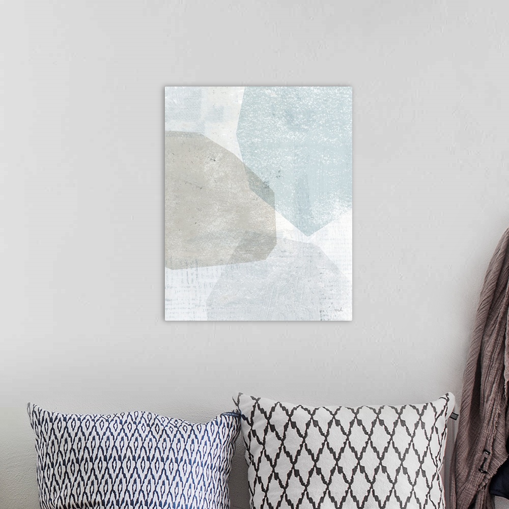 A bohemian room featuring Abstract painting with overlapping shapes in muted blue, white, and grey hues.