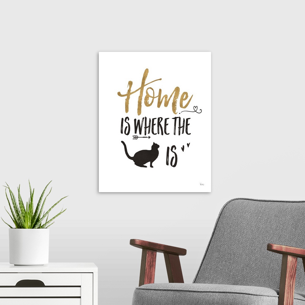 A modern room featuring "Home is Where the (cat) is" in black and gold.