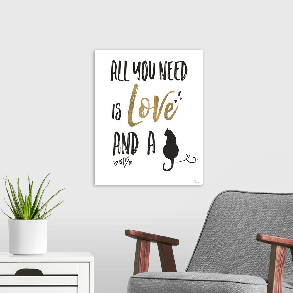 A modern room featuring "All You Need is Love and a (cat)" in black and gold.