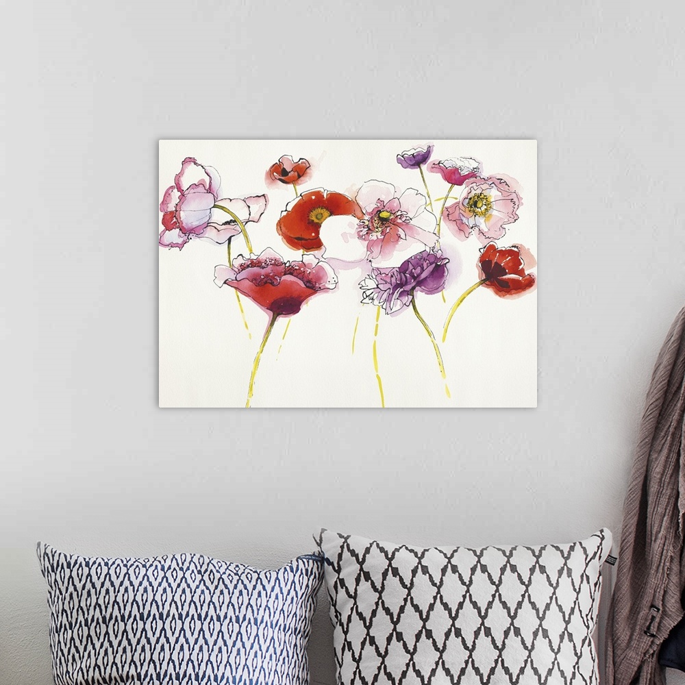 A bohemian room featuring Watercolor painting of pink purple and red flower against a neutral background.