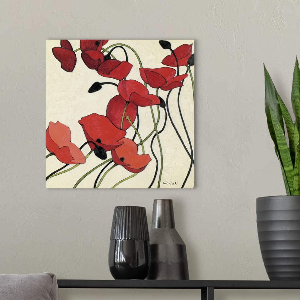 A modern room featuring Contemporary artwork of red poppies on long thin stems that are painted on a neutral background.