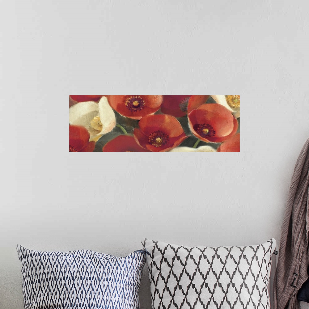 A bohemian room featuring Contemporary artwork of different brightly colored flowers close-up in the frame of the image.