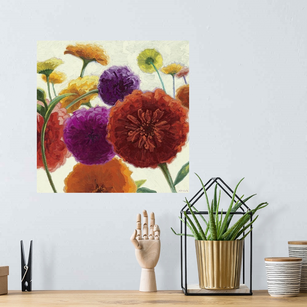 A bohemian room featuring Square painting on canvas of big multicolored flowers on a neutral background.