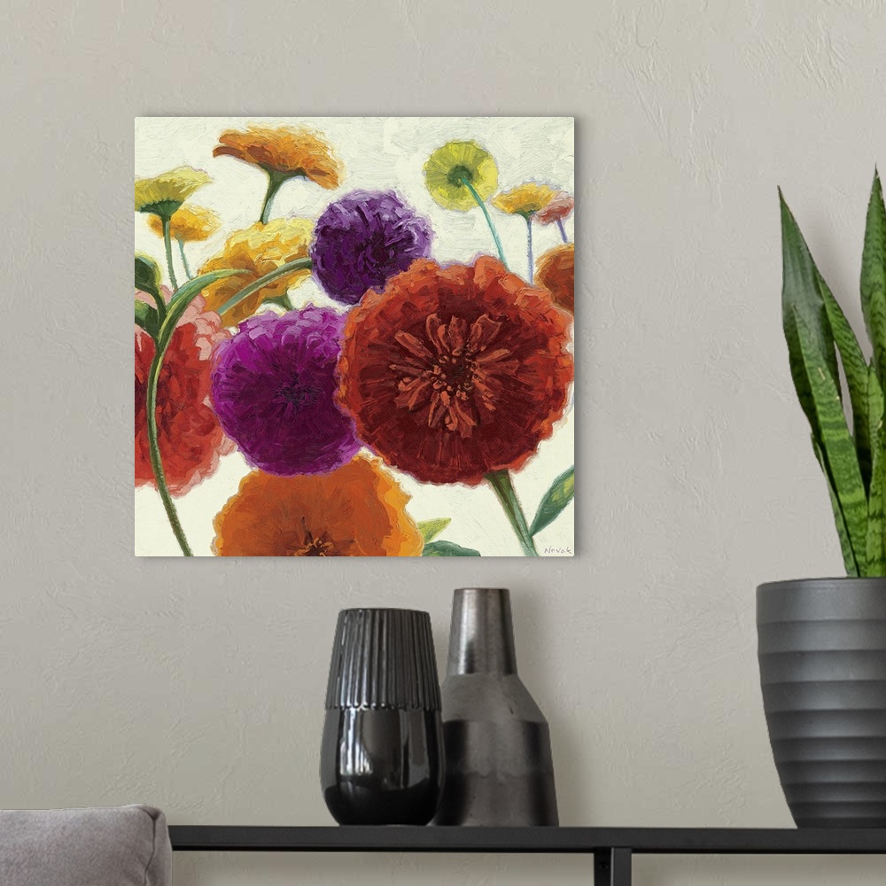 A modern room featuring Square painting on canvas of big multicolored flowers on a neutral background.