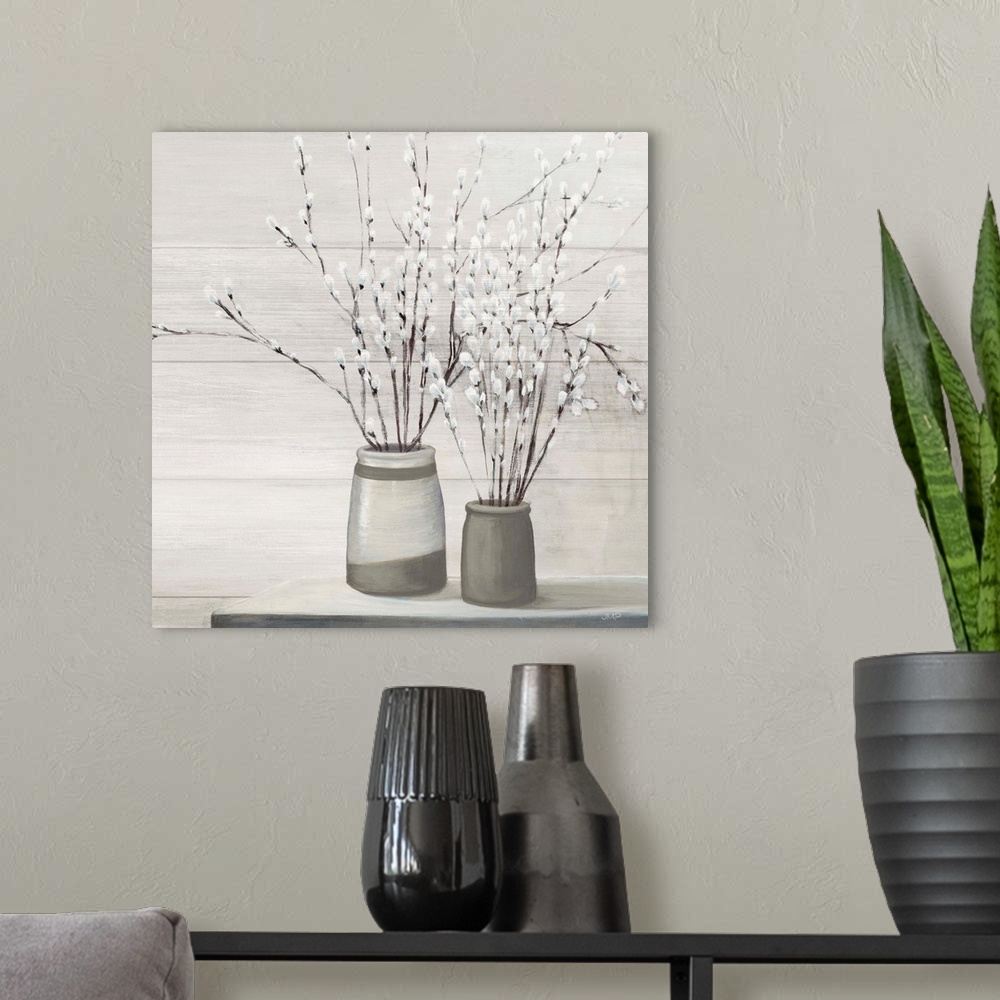 A modern room featuring Contemporary artwork of a serene still life scene of pussy willows in gray vases.