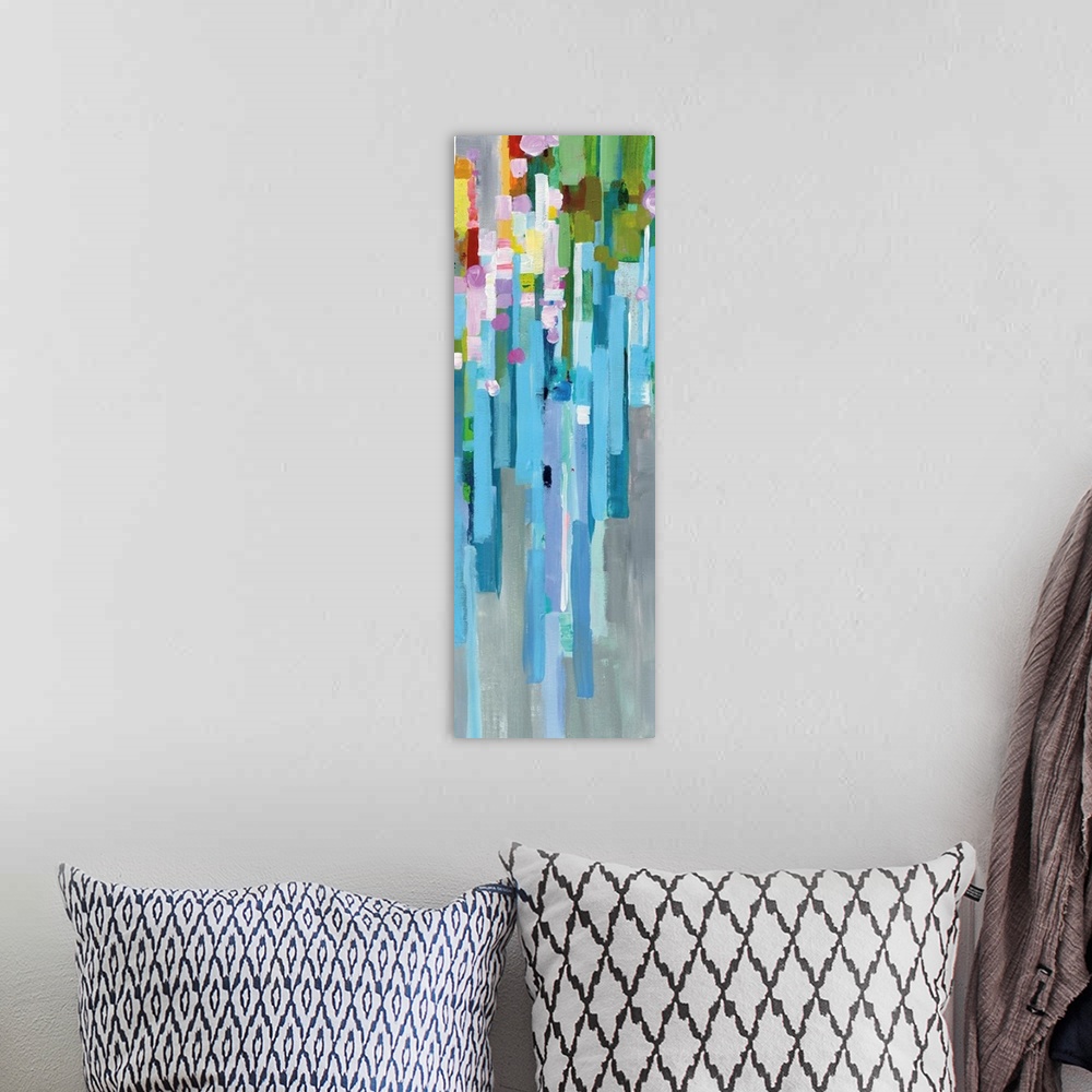 A bohemian room featuring Tall, rectangular abstract painting with rainbow vertical rectangles stacked together and falling...