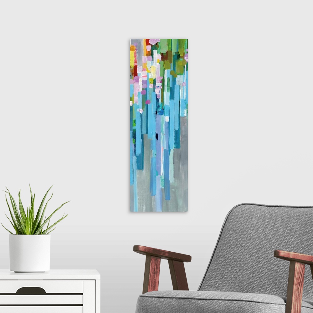 A modern room featuring Tall, rectangular abstract painting with rainbow vertical rectangles stacked together and falling...