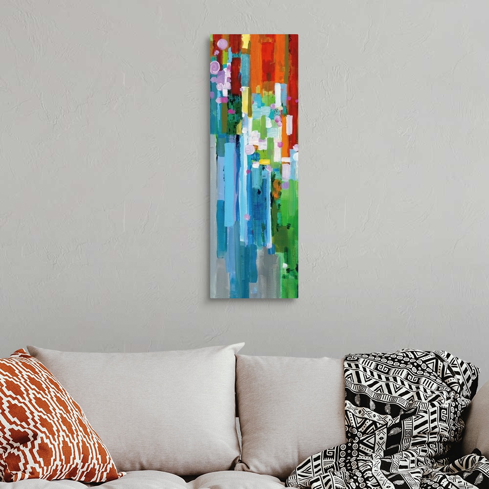 A bohemian room featuring Tall, rectangular abstract painting with rainbow vertical rectangles stacked together and falling...