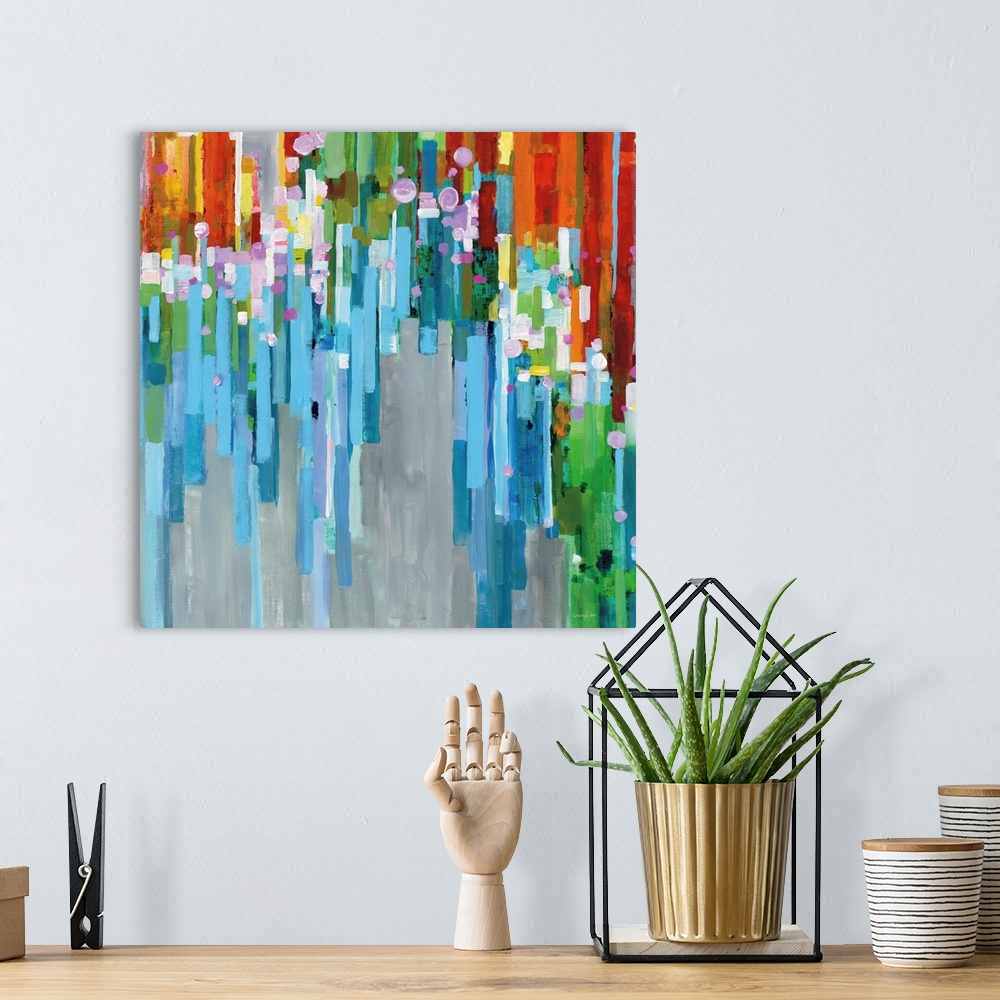 A bohemian room featuring Square abstract painting with rainbow vertical rectangles stacked together and falling from the d...