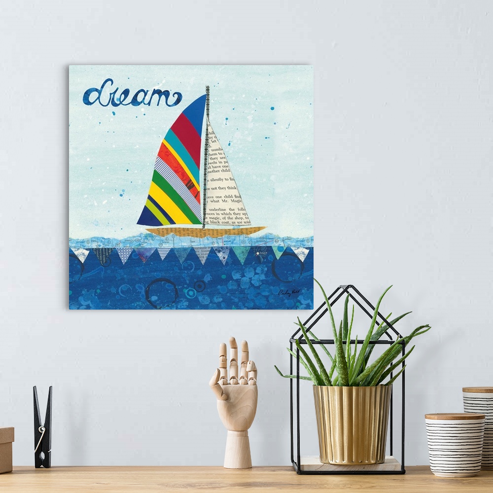 A bohemian room featuring Decorative collage artwork featuring a whimsical sailboat floating on the sea with the word, 'Dre...