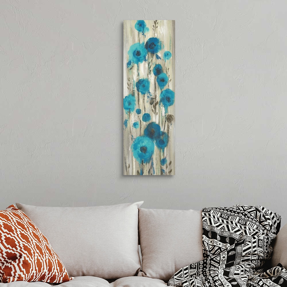 A bohemian room featuring Contemporary artwork of abstract blue flowers over cascading gray color.