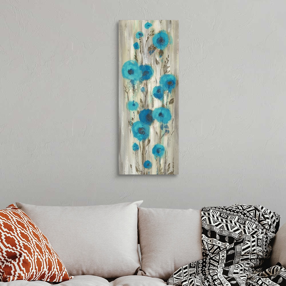 A bohemian room featuring Contemporary artwork of abstract blue flowers over cascading gray color.