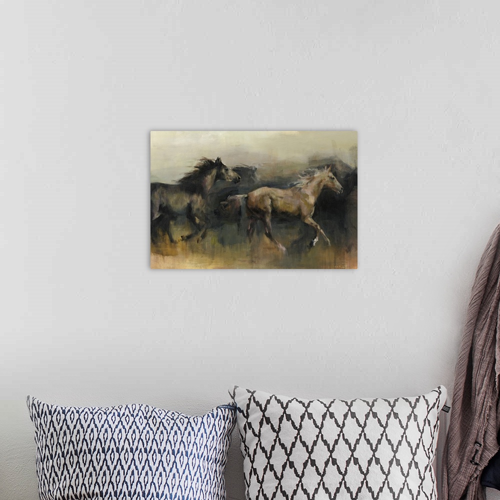 A bohemian room featuring Contemporary painting of a black and a brown horse galloping in the western desert.