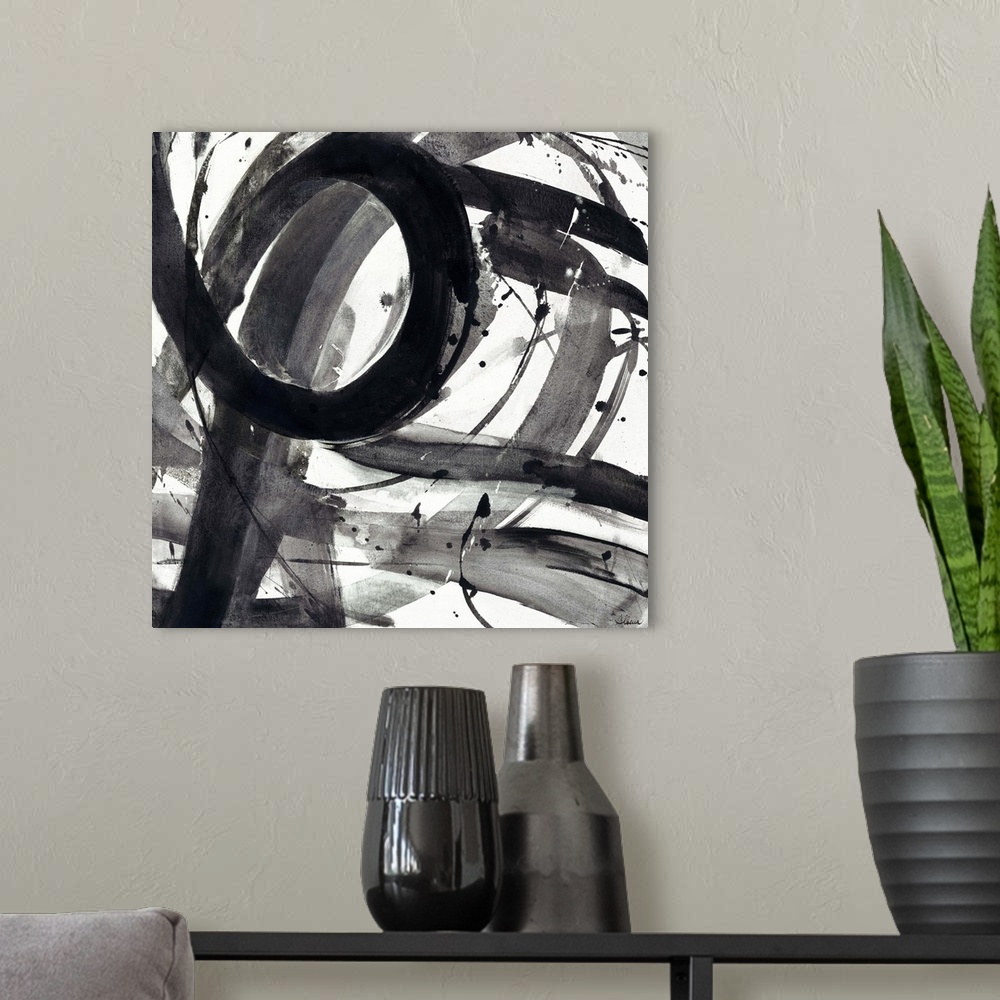 A modern room featuring Contemporary abstract painting of black semi-transparent strokes against a white background.