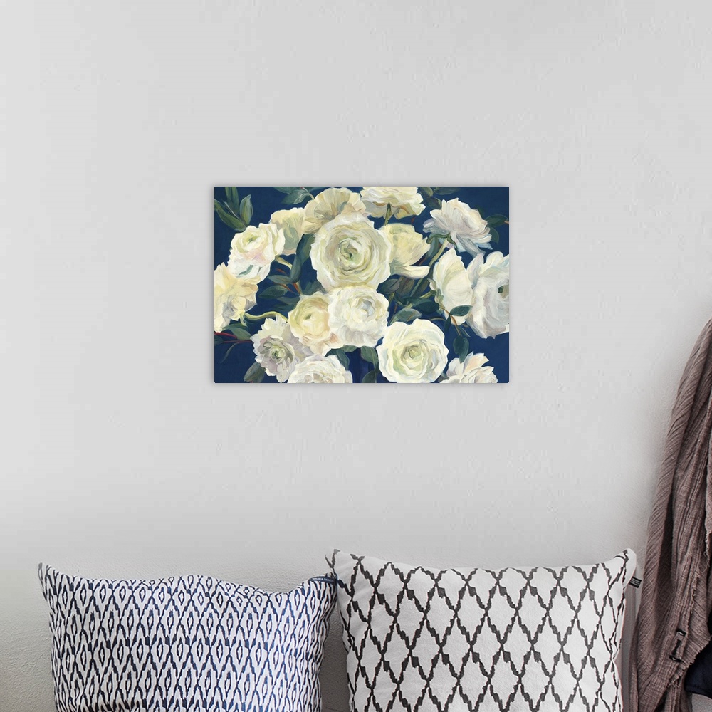 A bohemian room featuring A large contemporary painting of a full bloomed white roses against of blue backdrop.