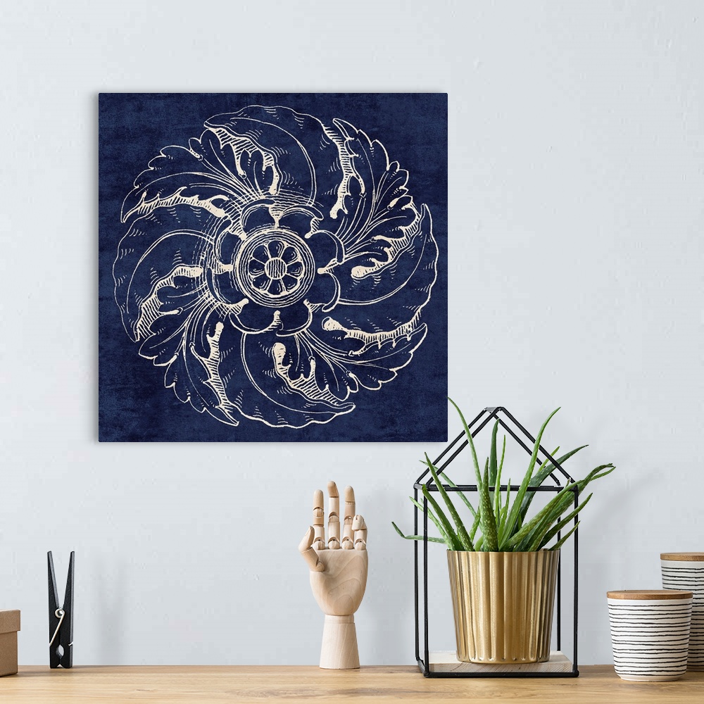 A bohemian room featuring Contemporary artwork of a vintage stylized rosette in dark blue.