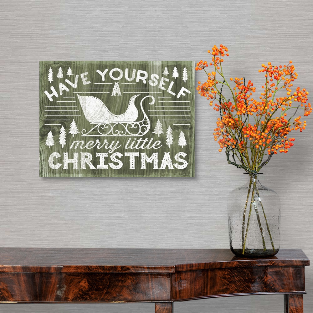 A traditional room featuring "Have Yourself a Merry Little Christmas" decorative holiday art on a green wood background.