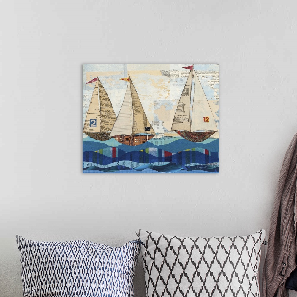 A bohemian room featuring Mixed media artwork of three sailboats on the ocean.