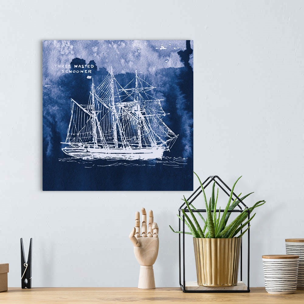 A bohemian room featuring Square art with a white silhouette of a sailboat on an indigo watercolor background and "Three Ma...