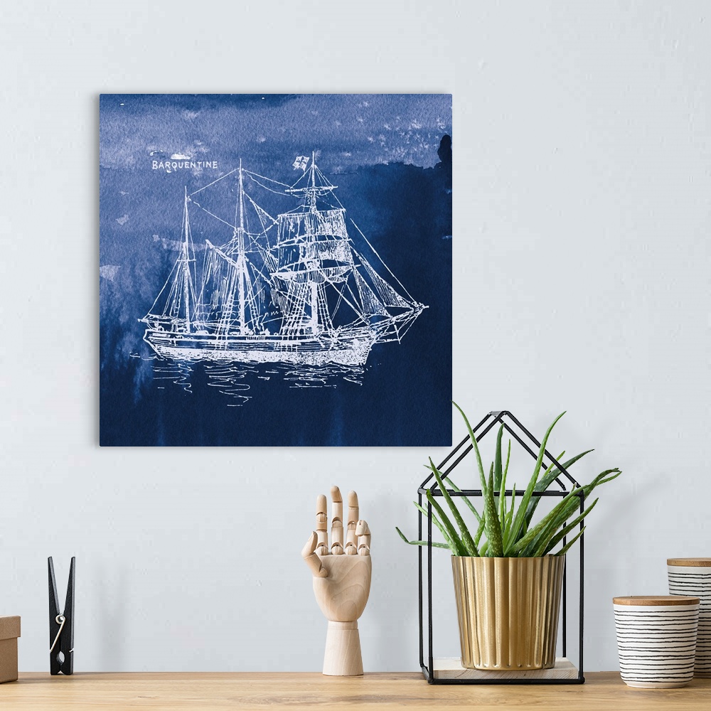 A bohemian room featuring Square art with a white silhouette of a sailboat on an indigo watercolor background and "Barquent...