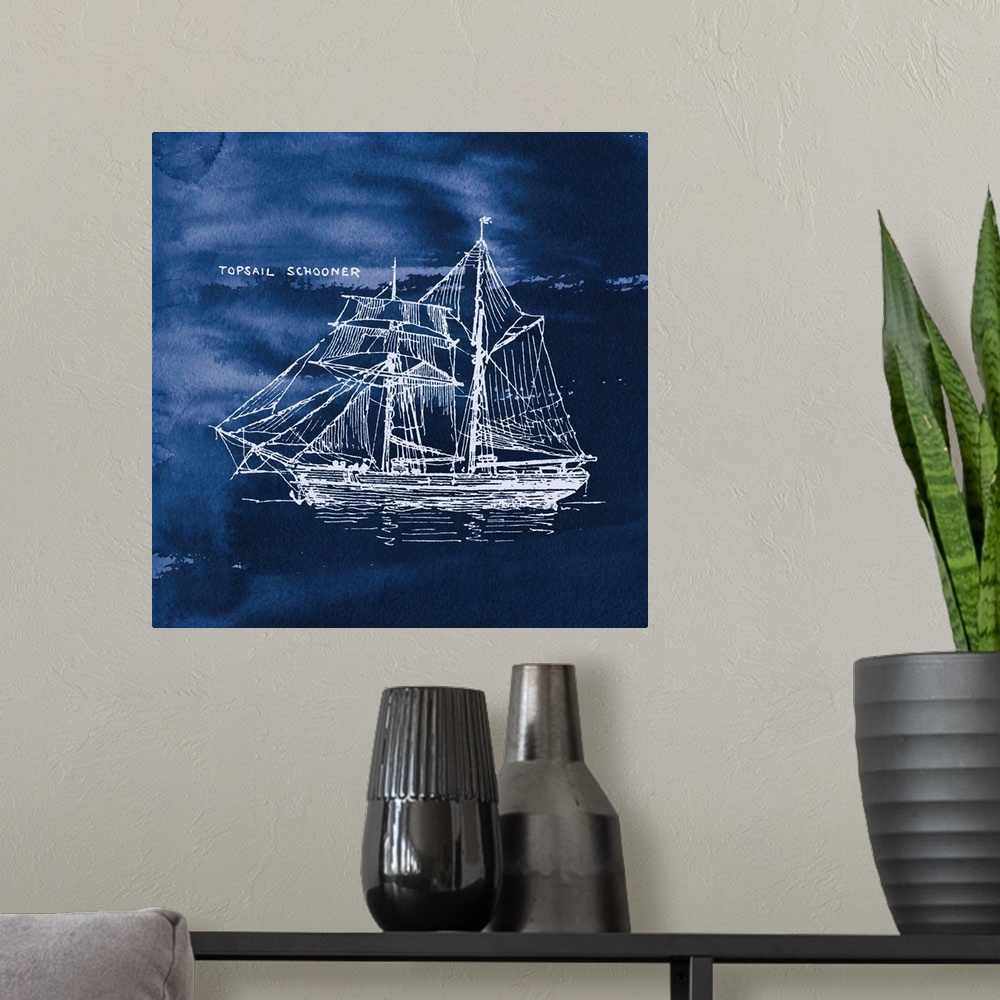A modern room featuring Square art with a white silhouette of a sailboat on an indigo watercolor background and "Topsail ...