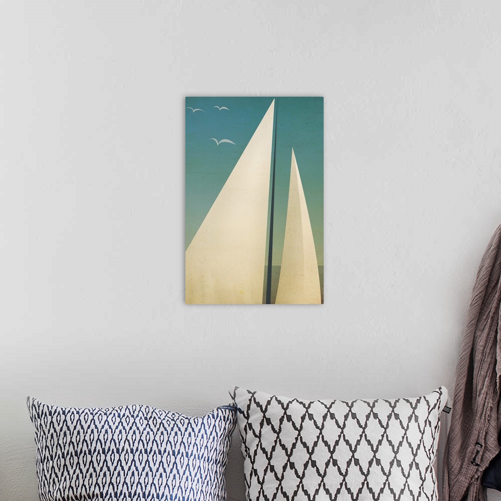 A bohemian room featuring Contemporary artwork of sails seen against a dark blue sky.
