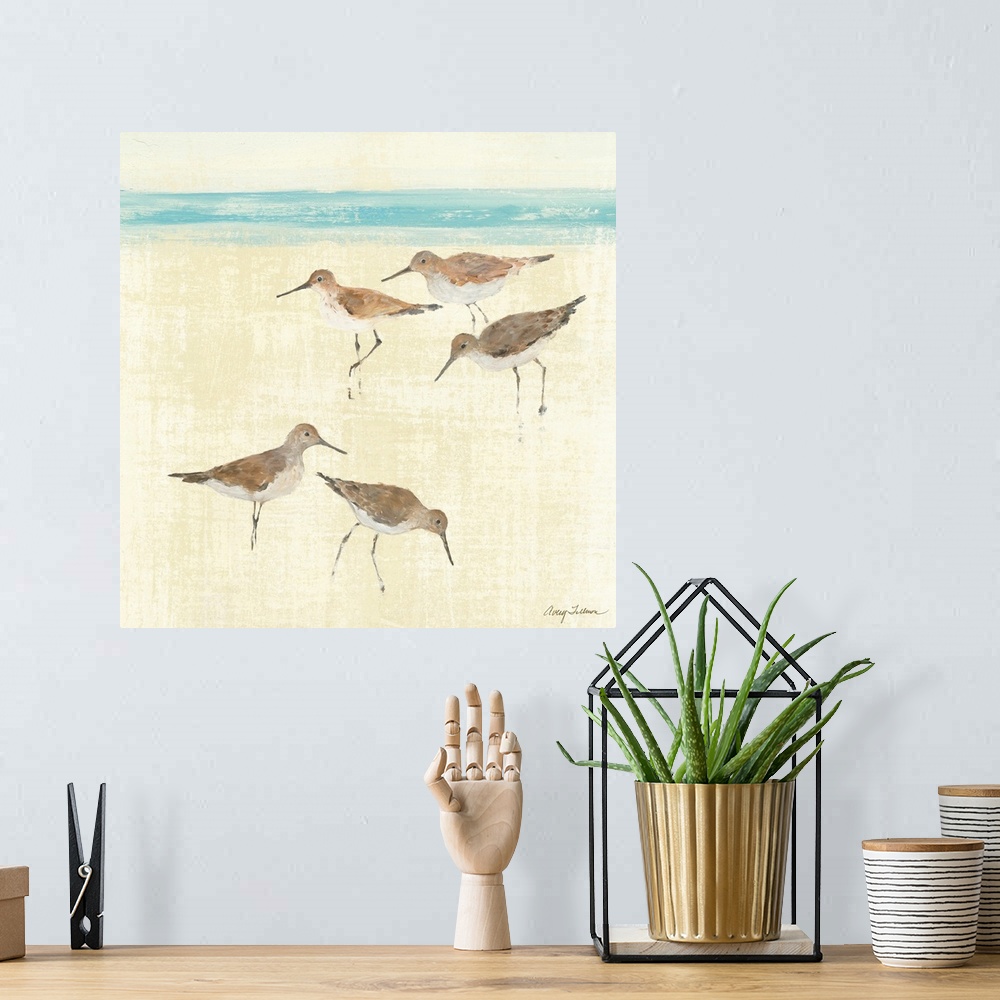A bohemian room featuring Square painting of ocean birds walking on the sand of a beach with the sea in the distance.