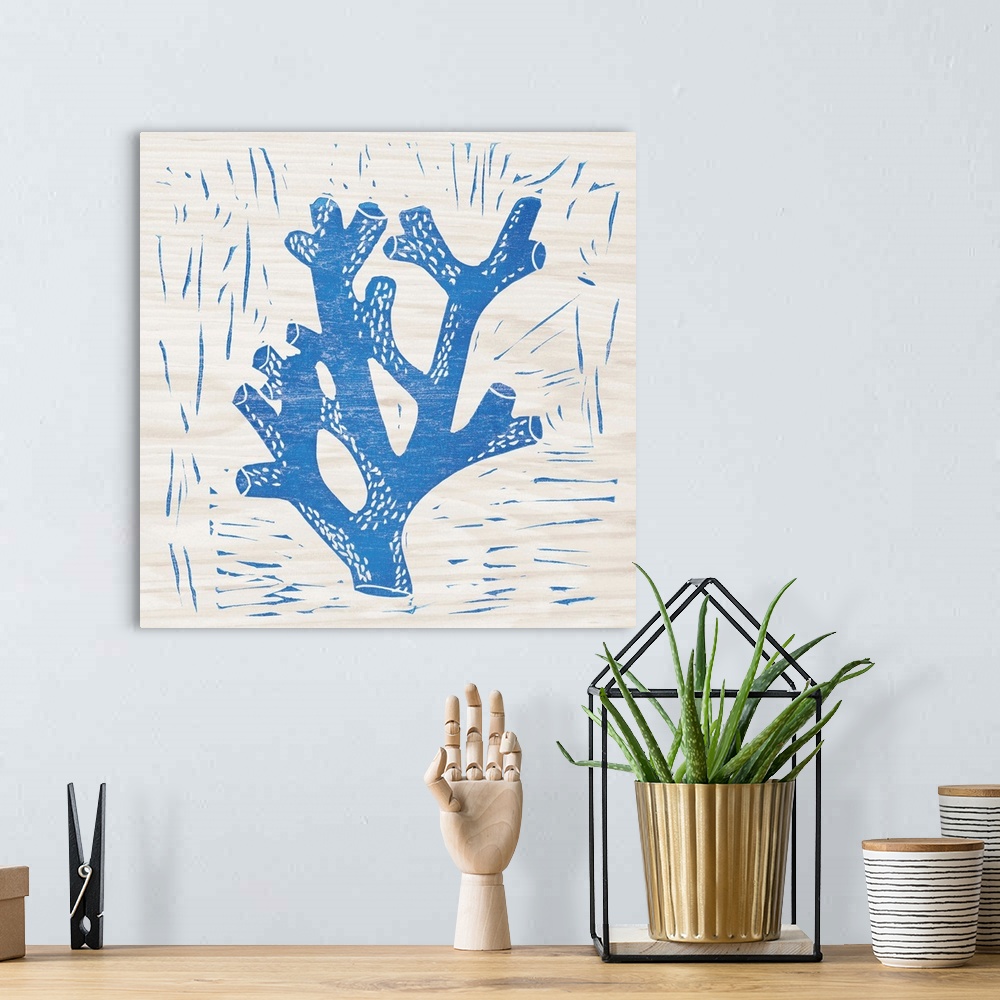 A bohemian room featuring Blue woodcut-style coral print on wood.