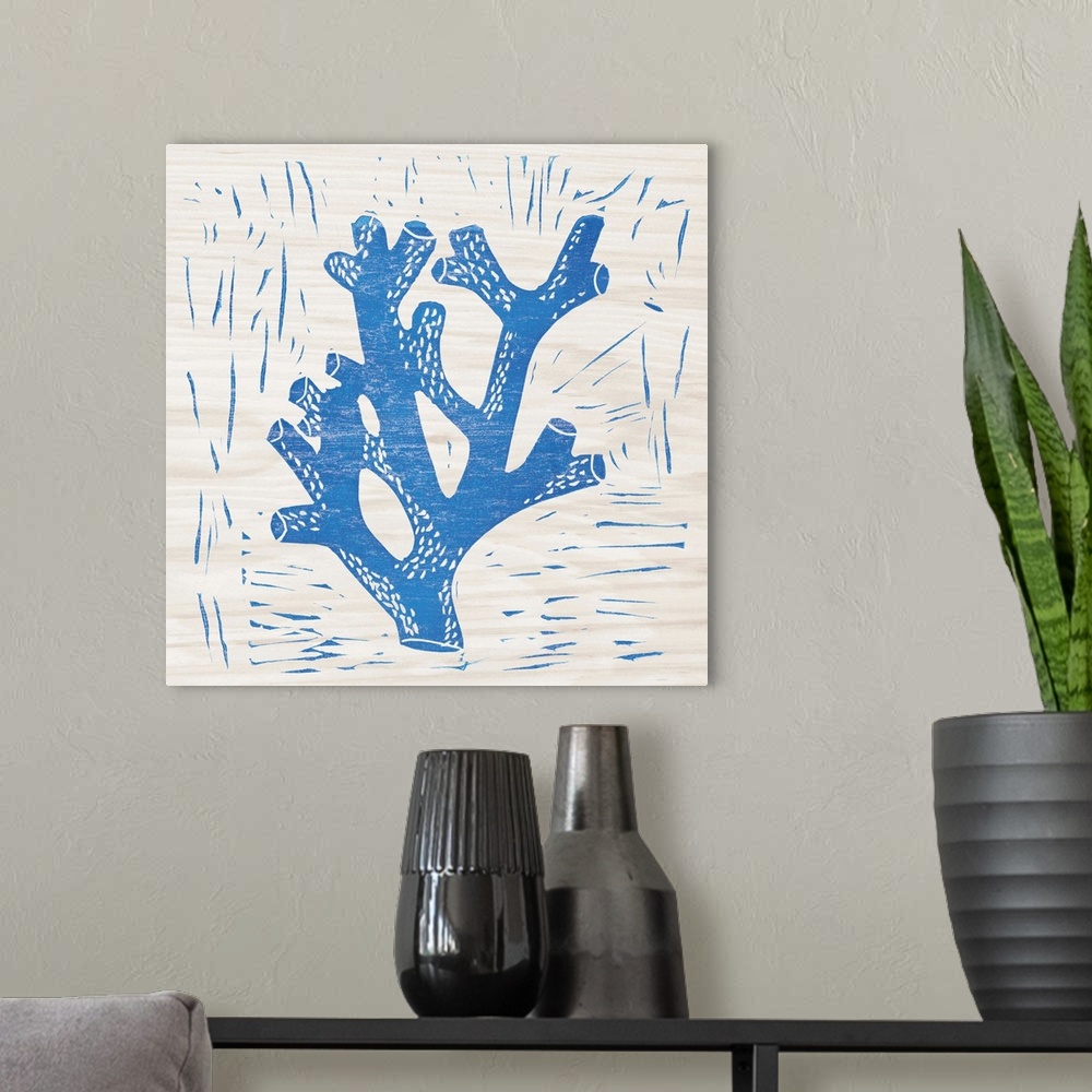A modern room featuring Blue woodcut-style coral print on wood.