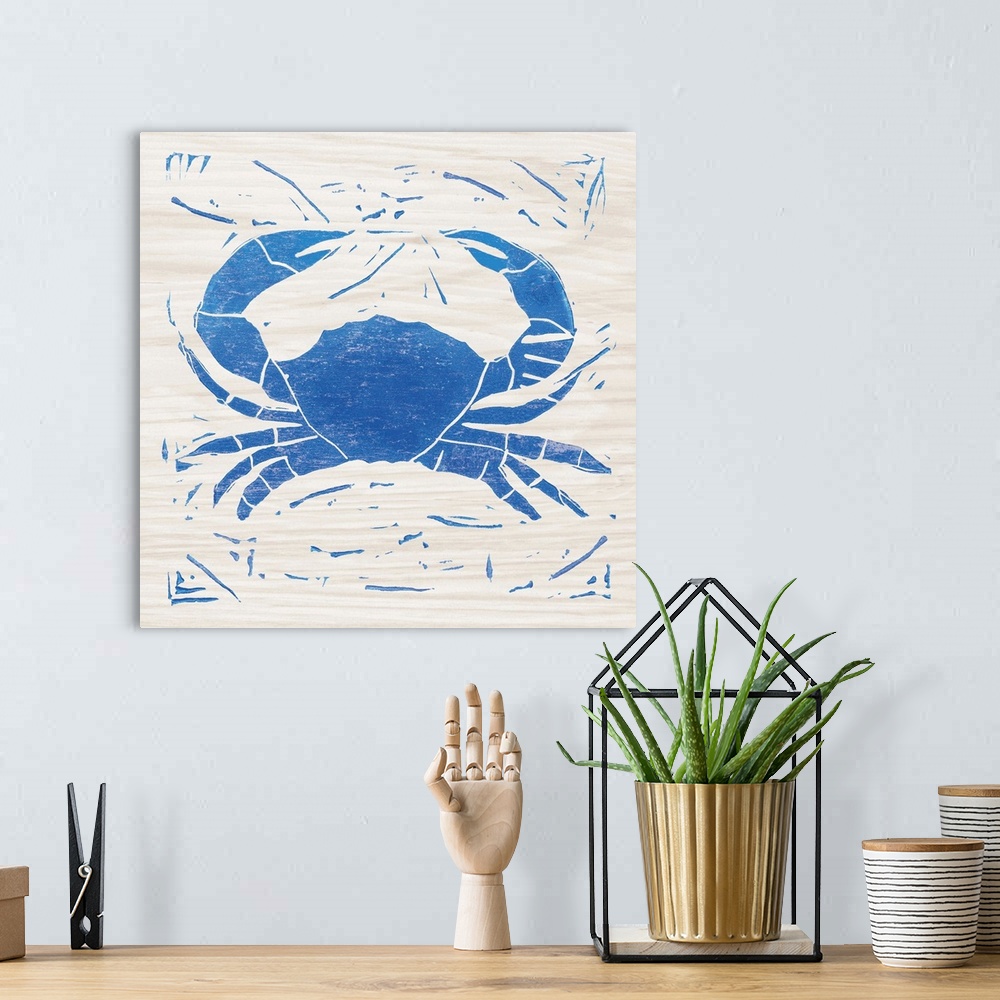 A bohemian room featuring Blue woodcut-style crab print on wood.