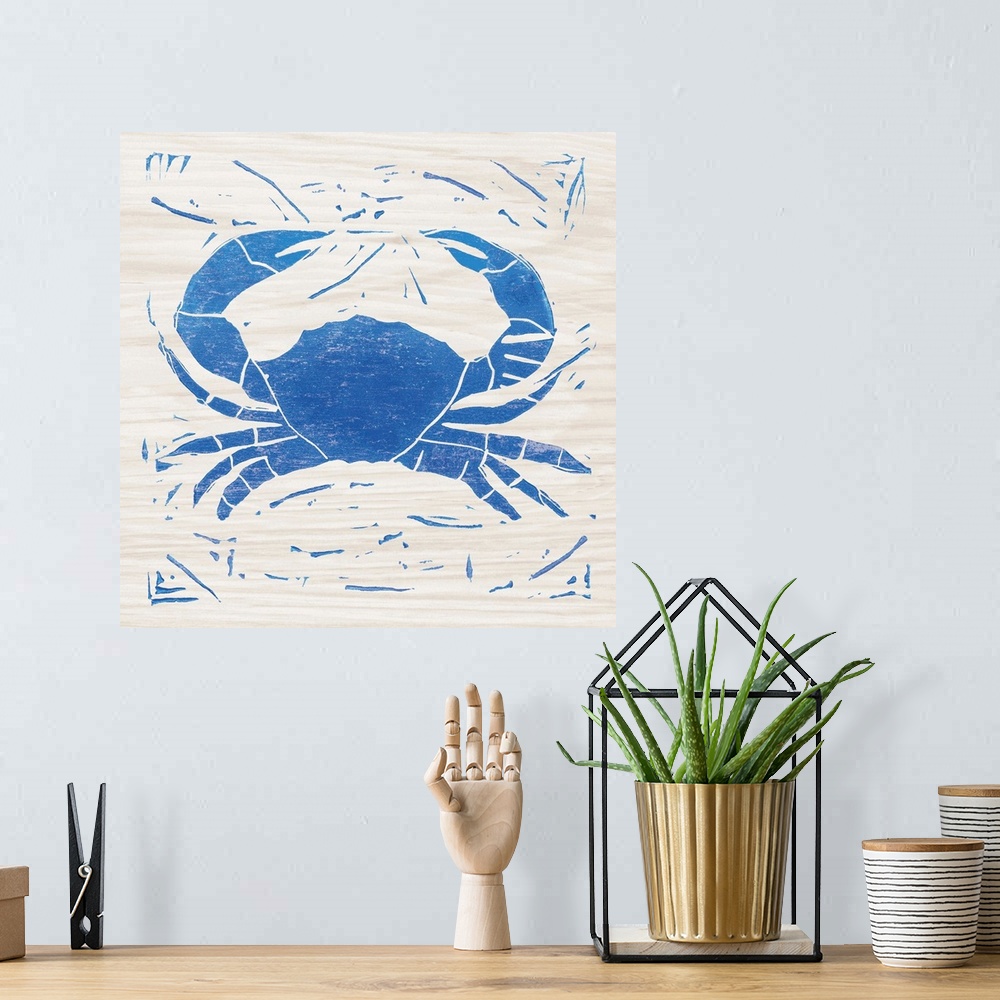 A bohemian room featuring Blue woodcut-style crab print on wood.