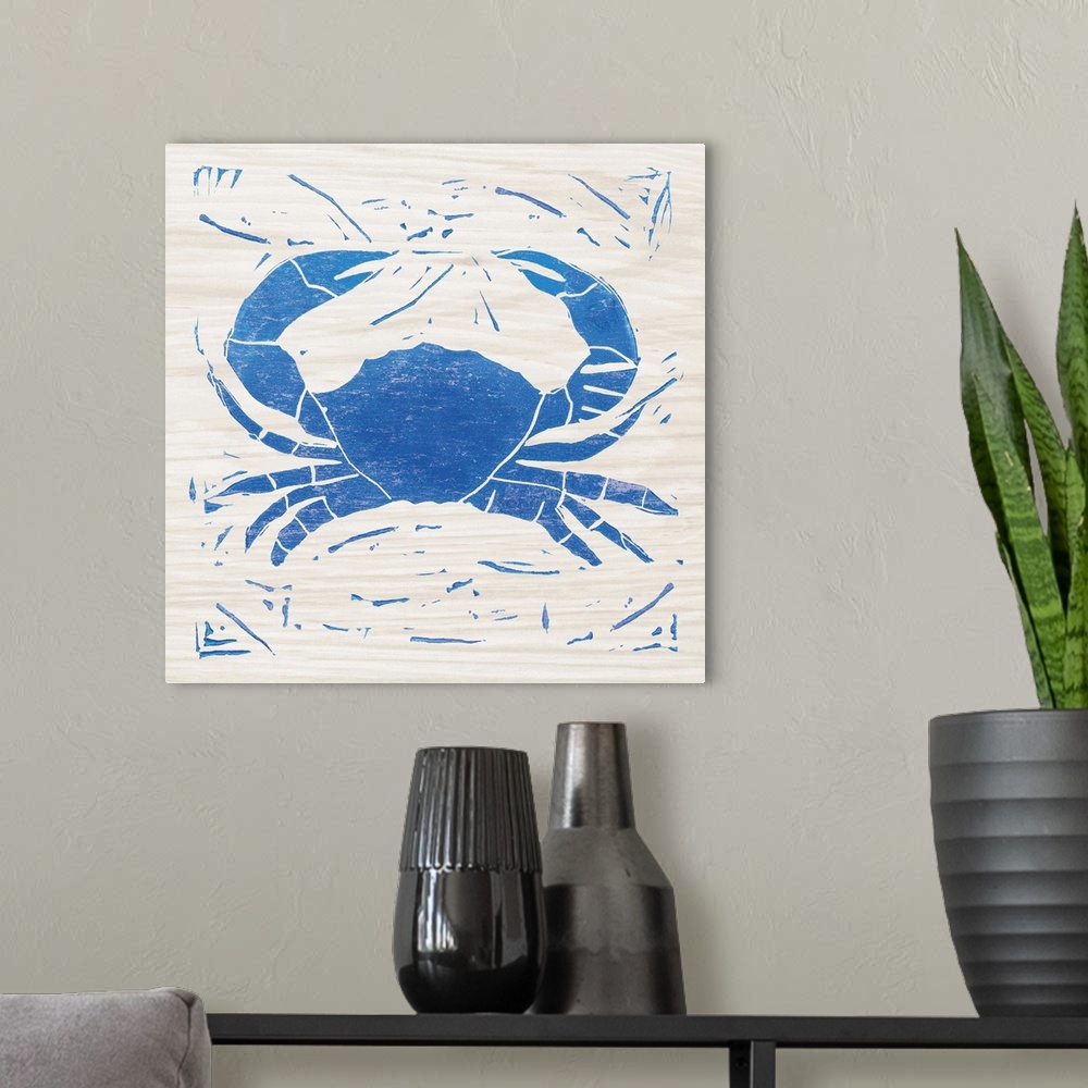 A modern room featuring Blue woodcut-style crab print on wood.