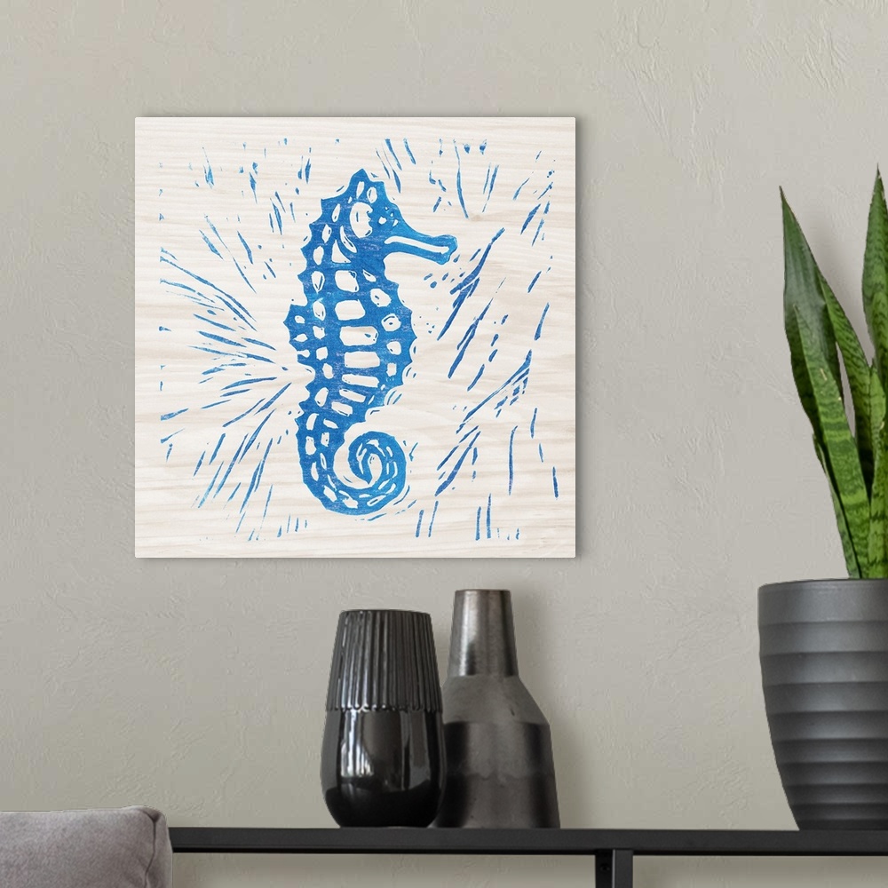 A modern room featuring Blue woodcut-style seahorse print on wood.