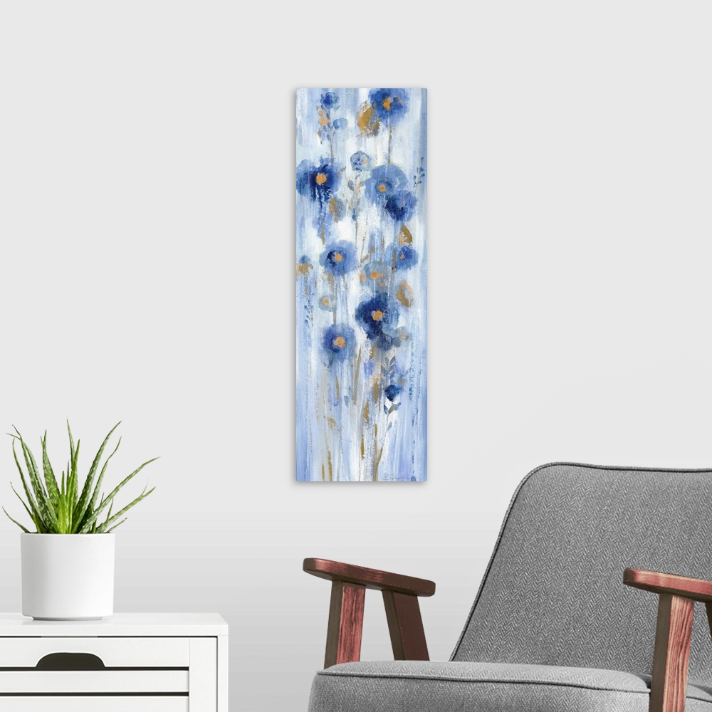 A modern room featuring Long vertical abstract painting of blue flowers with accents of gold.