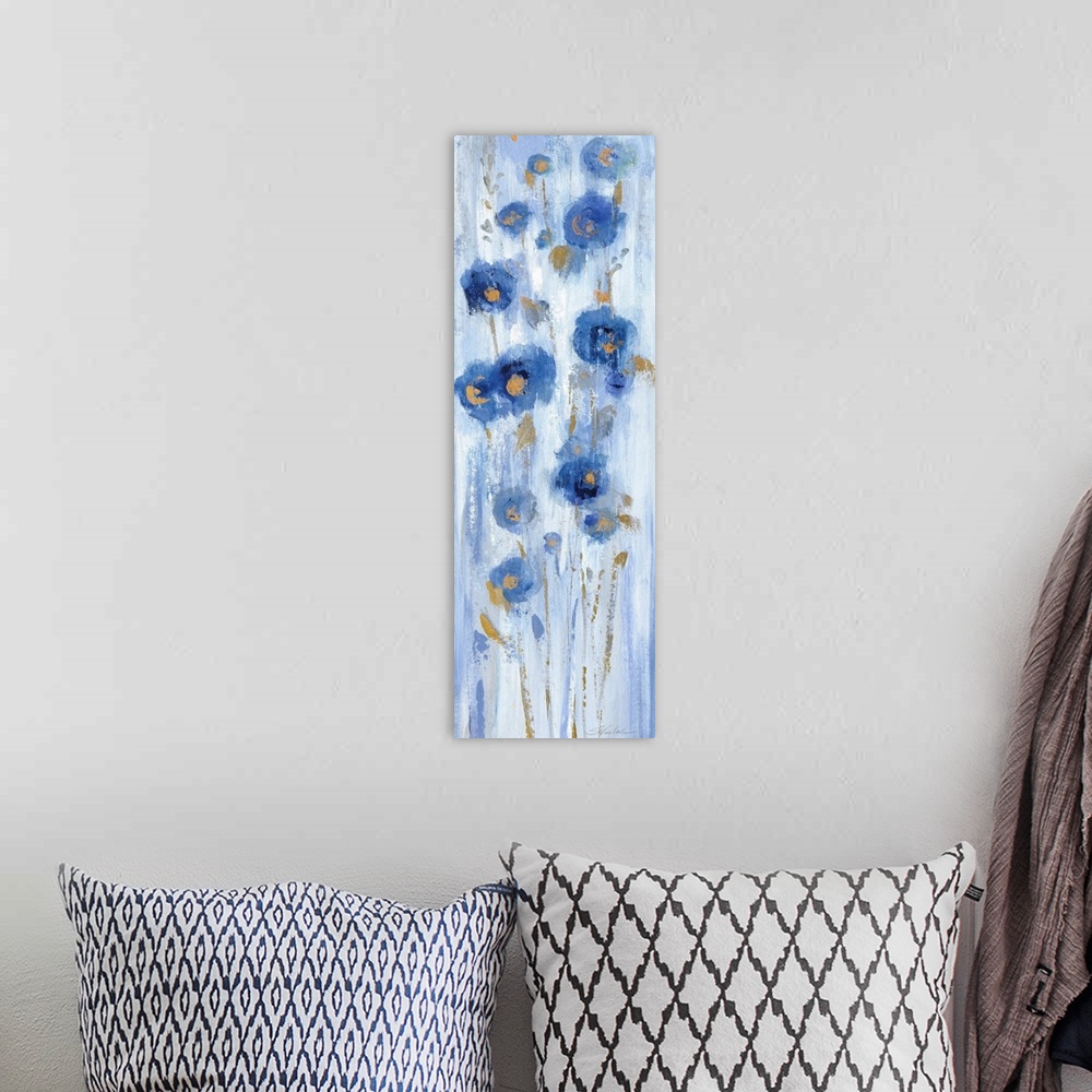 A bohemian room featuring Long vertical abstract painting of blue flowers with accents of gold.