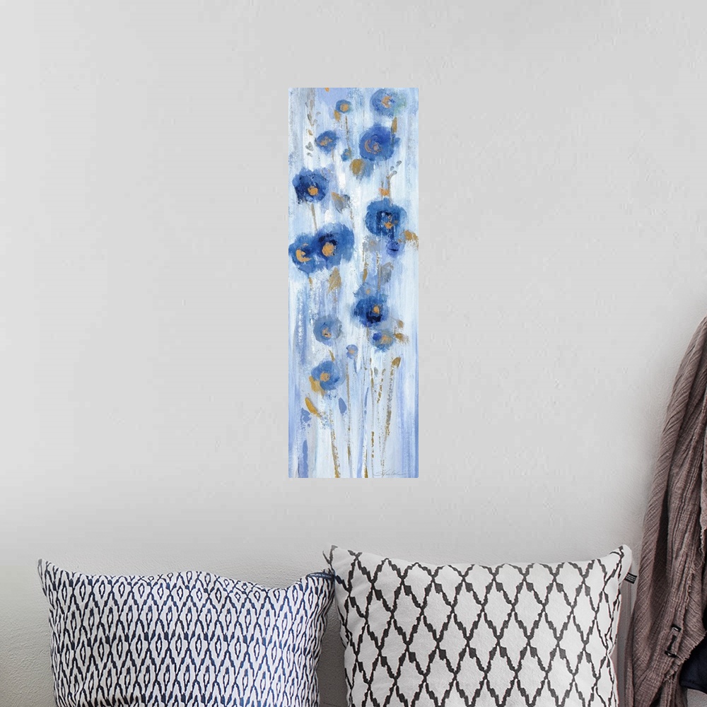 A bohemian room featuring Long vertical abstract painting of blue flowers with accents of gold.