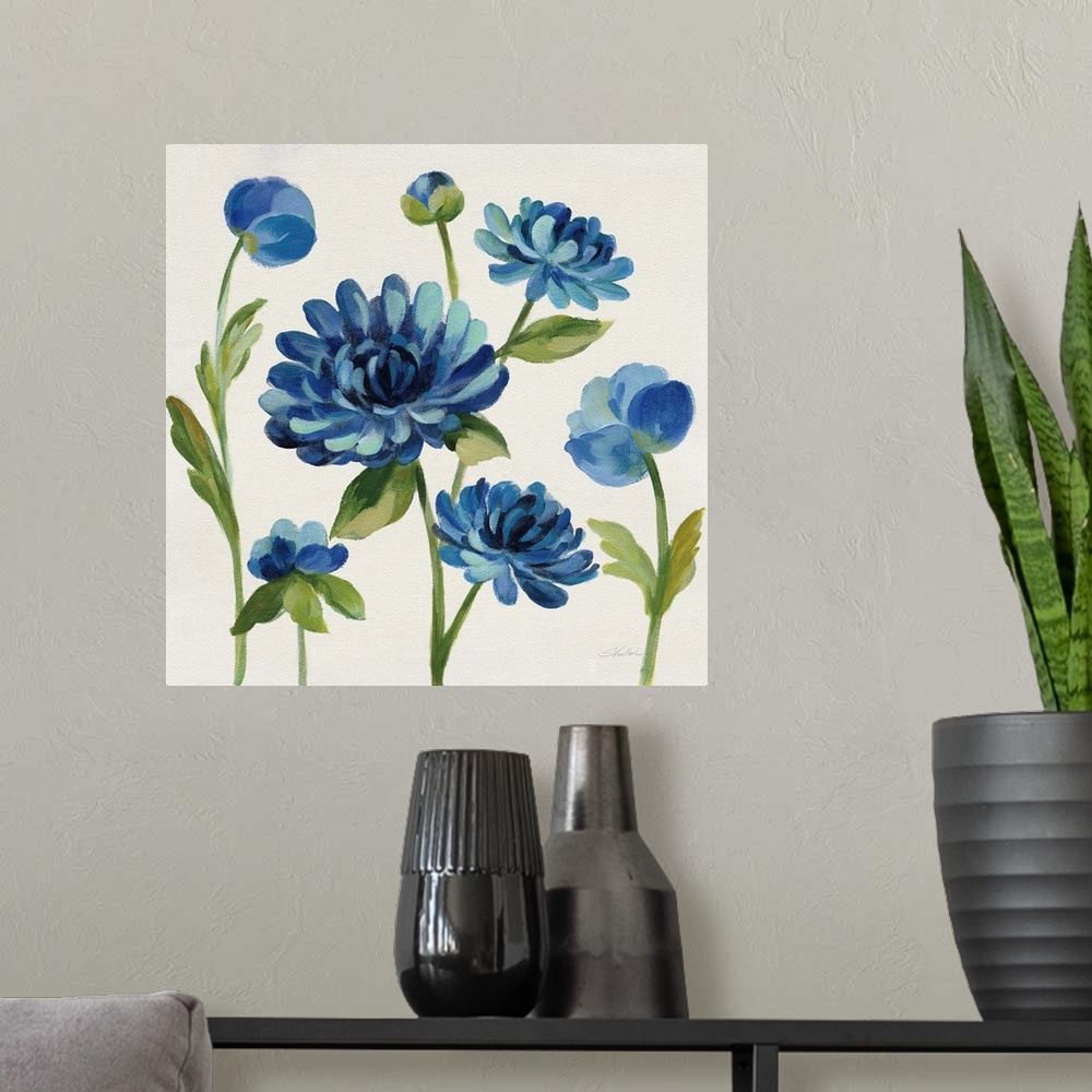 A modern room featuring Square painting of blue flowers on an off white background.