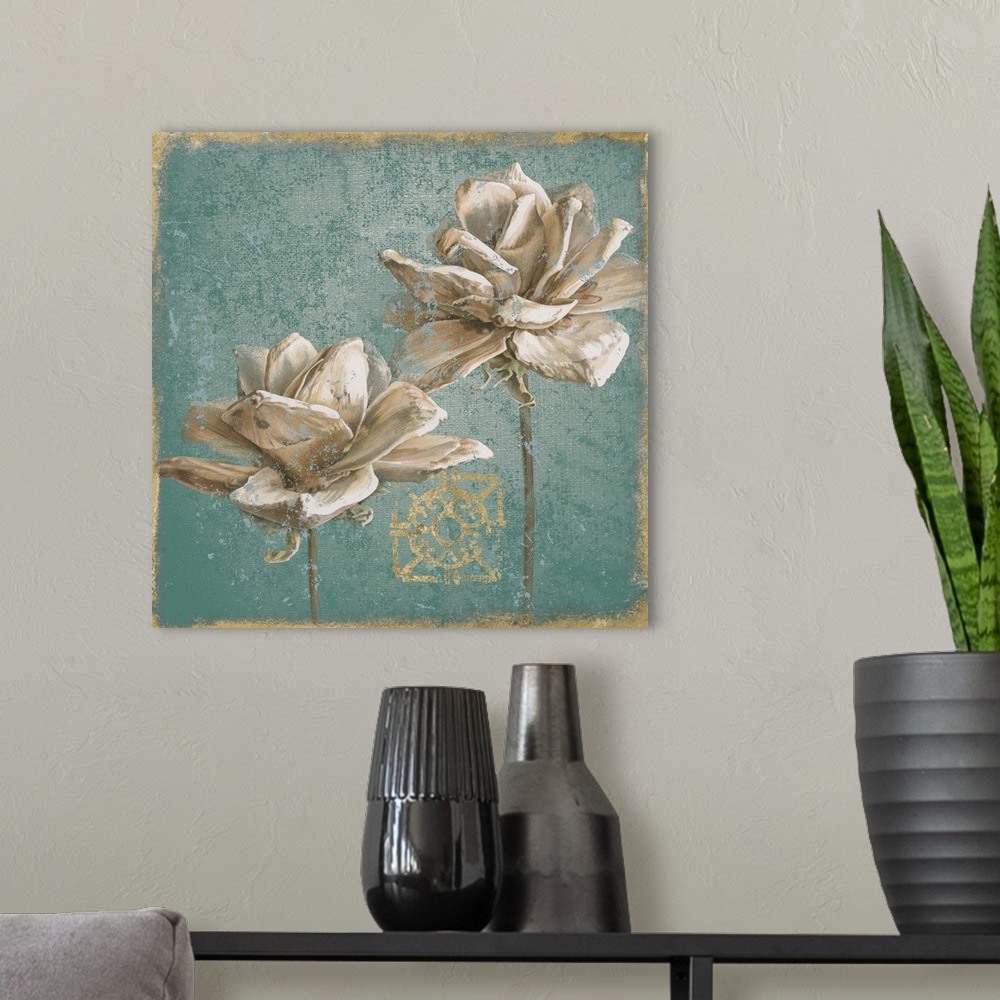 A modern room featuring A square decorative artwork of two large white blooms with a distress overlay and gold accents.