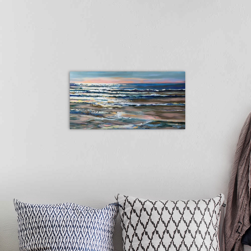 A bohemian room featuring A landscape painting of waves on the ocean being caught by the sunlight