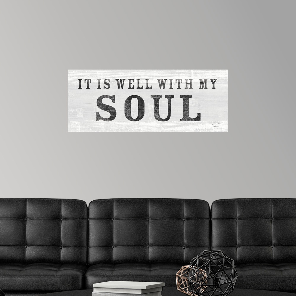 A modern room featuring "It Is Well With My Soul" against a light gray shiplap background.