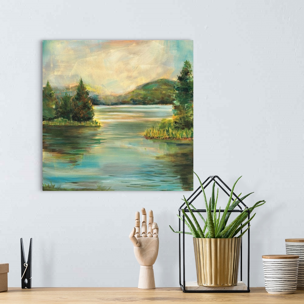 A bohemian room featuring Contemporary landscape painting of a lake at sunset with rolling hills in the distance.
