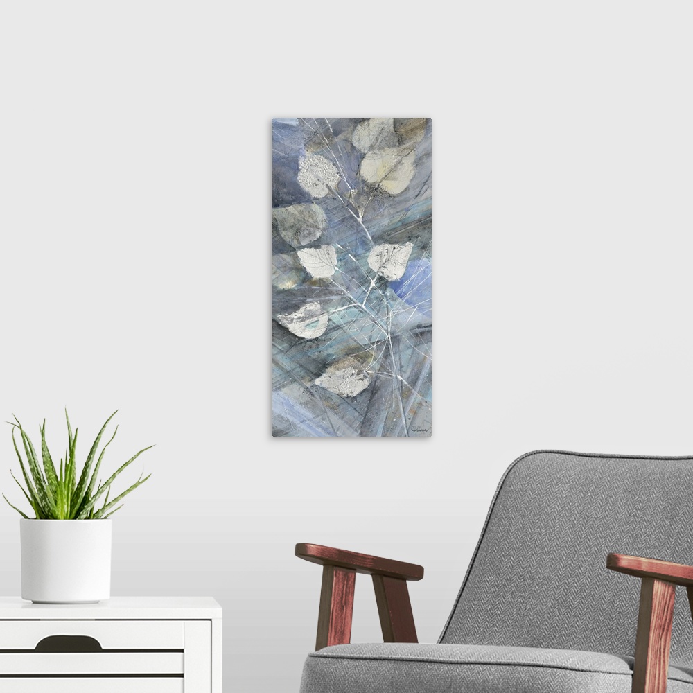 A modern room featuring Contemporary artwork of silver leaves against a blue toned background.