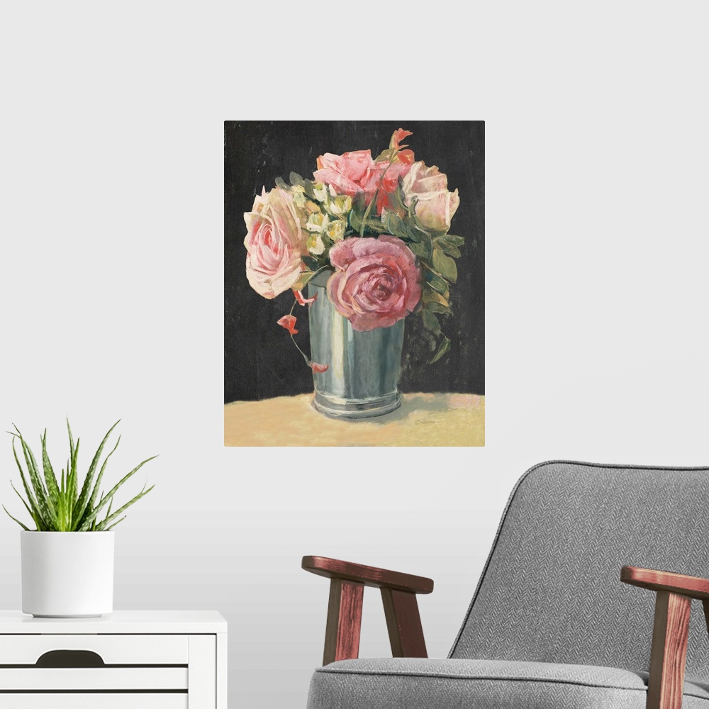 A modern room featuring Floral decor with pink roses and greenery in a silver vase on a black background.