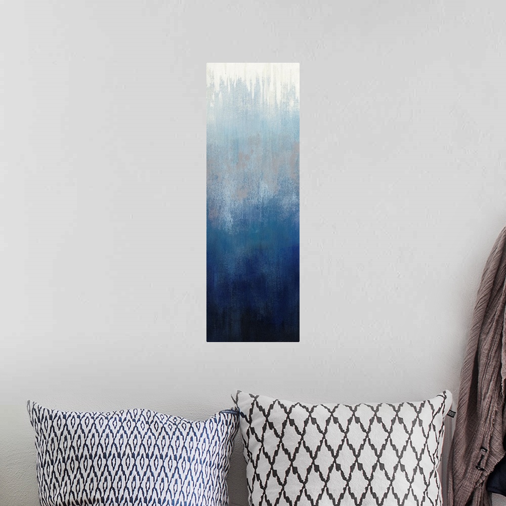 A bohemian room featuring Abstract panel painting in shades of gray and blue getting darker towards the bottom.