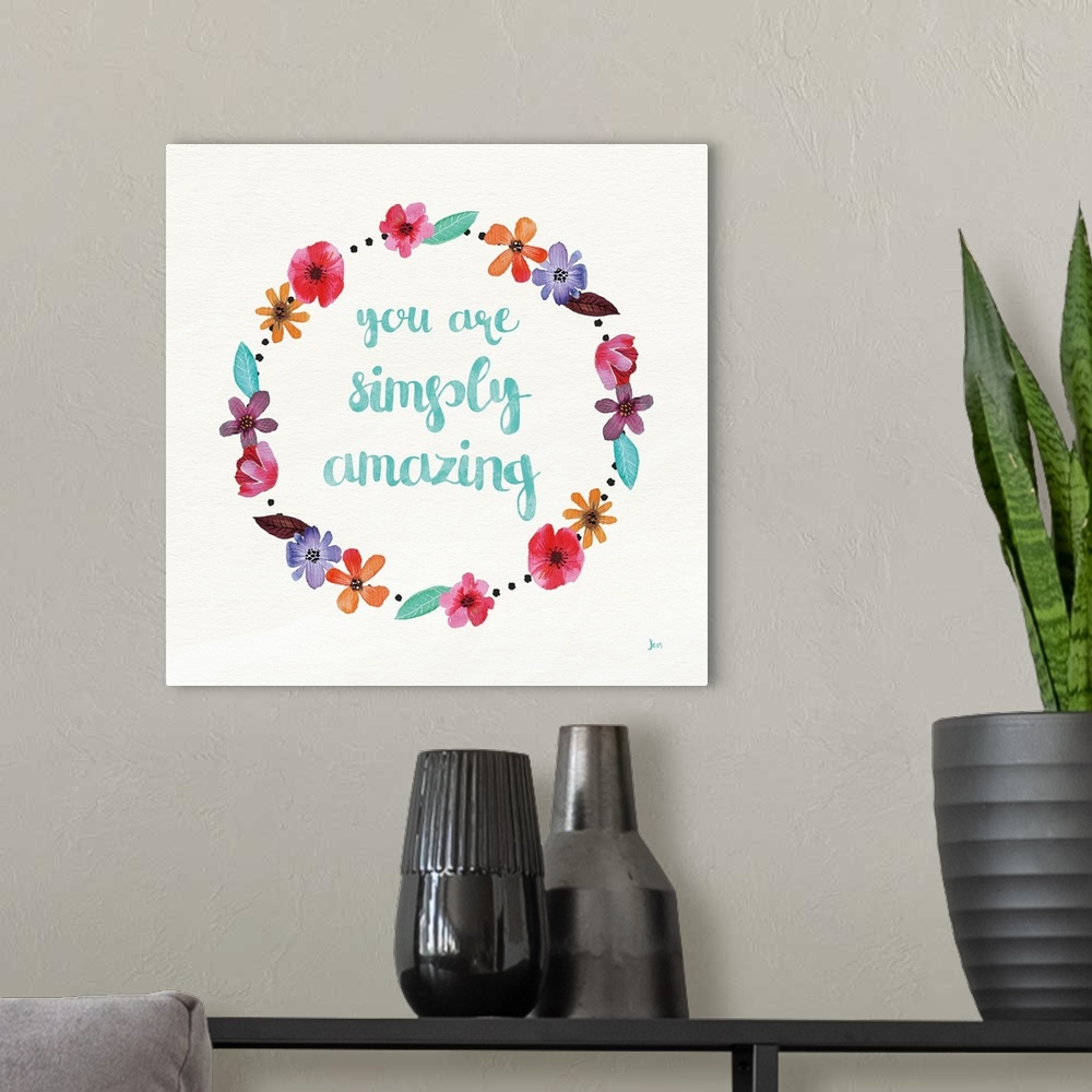 A modern room featuring "You Are Simply Amazing" in blue with a wreath of colorful flowers.