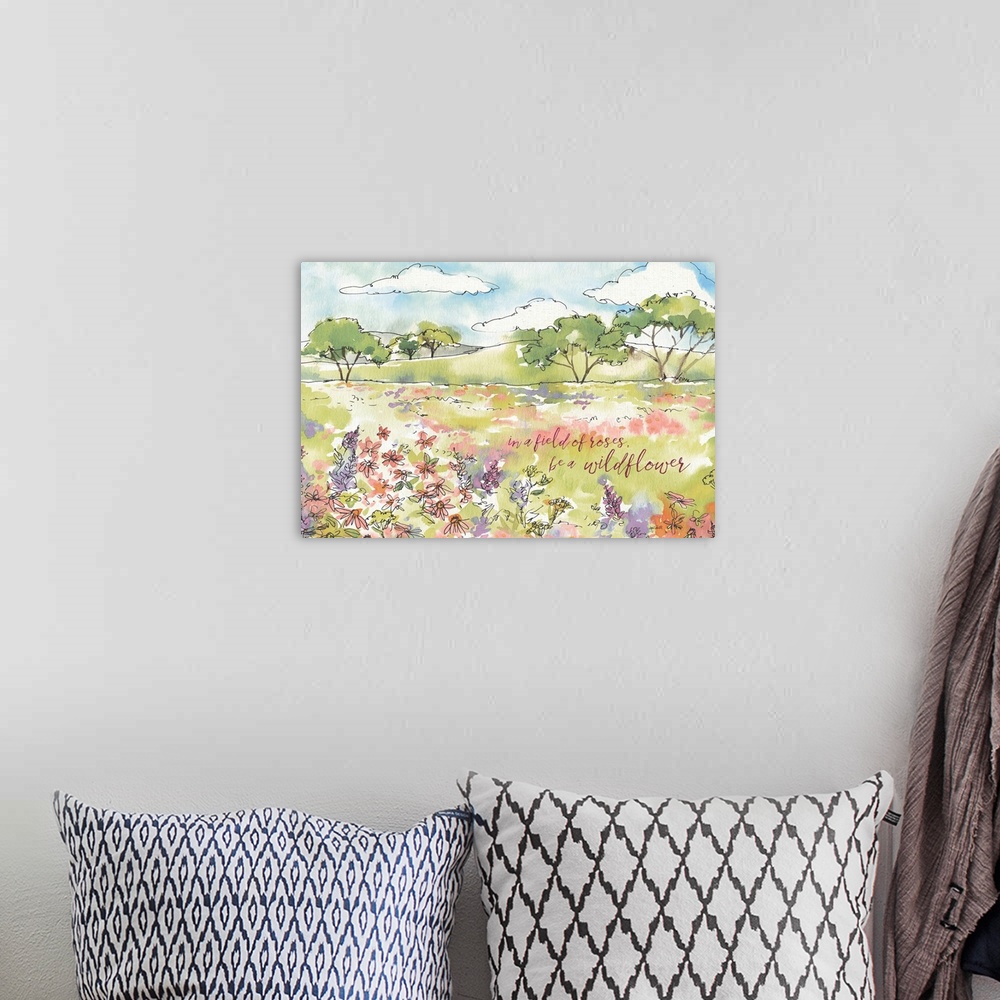 A bohemian room featuring A watercolor painting of a country scene of wildflowers in a field and the text "in a field of ro...