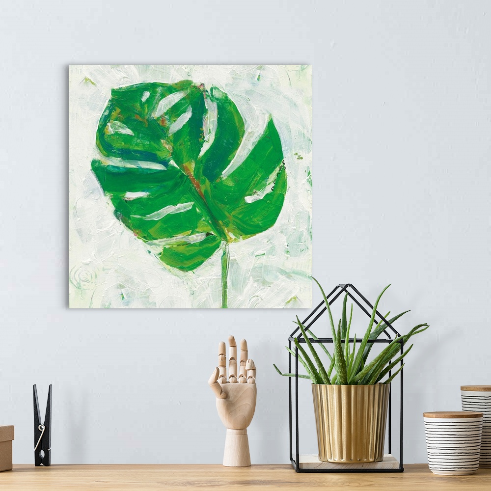 A bohemian room featuring Square abstract painting of a big, green, tropical leaf on a white textured background.
