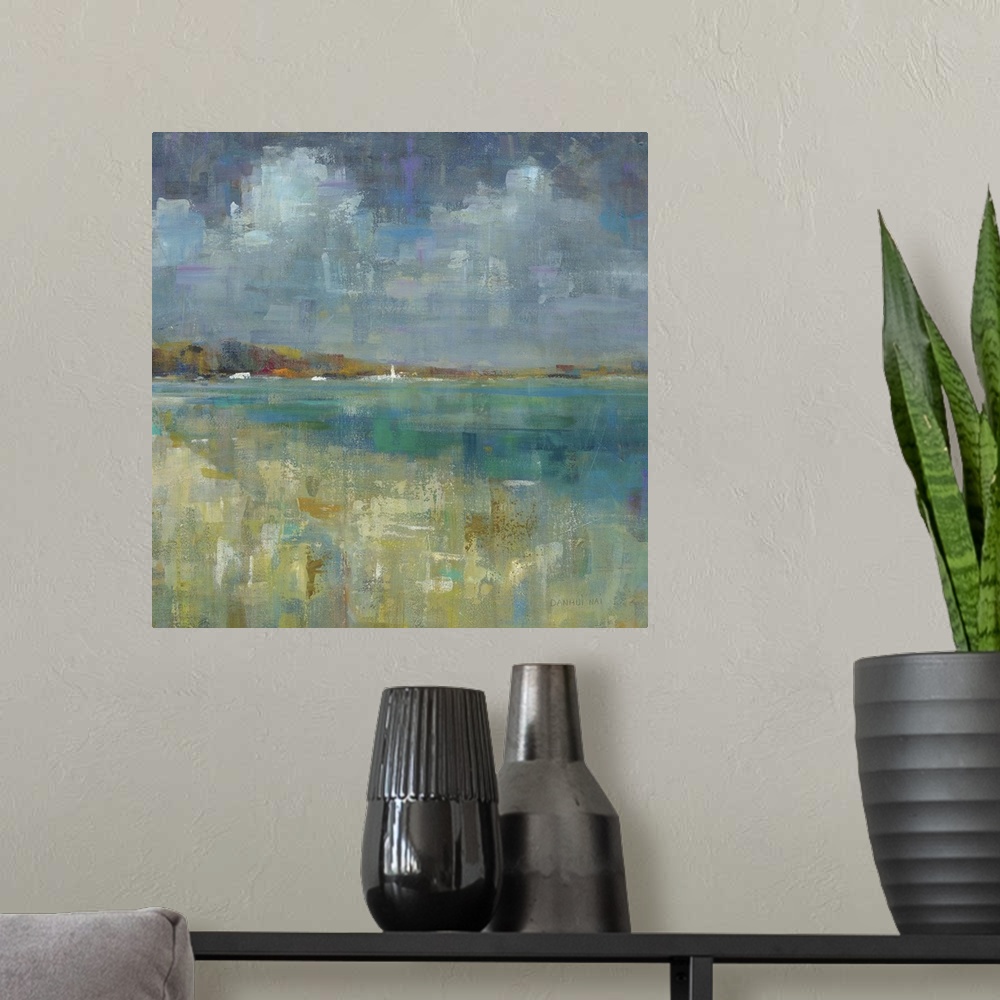 A modern room featuring Square abstract painting of the ocean and seashore made with short and small brushstrokes of color.