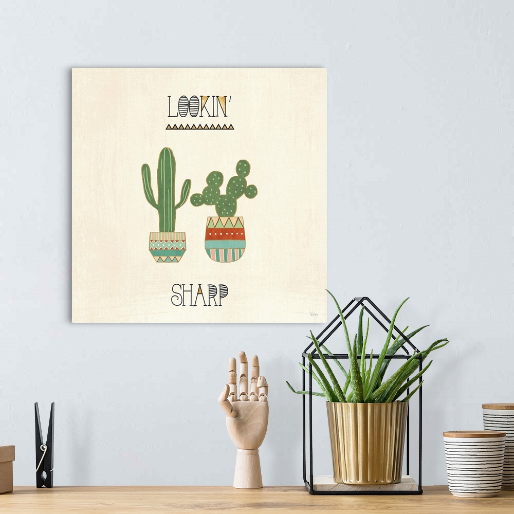 A bohemian room featuring "Lookin' Sharp" with two cactus in southwestern designed pots on a beige backdrop.